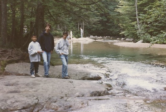 The brothers frown at the photographer, who is also their mother.