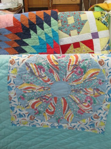 I wish I had bought this one, too.  It looked modern, but was made out of flour sacks.  This quilter had a wild side!