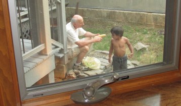 Shucking corn with Grandpa.